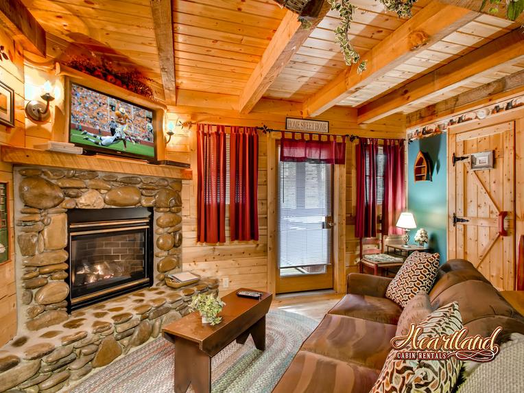 Living room with stone, gas fireplace and flat screen tv